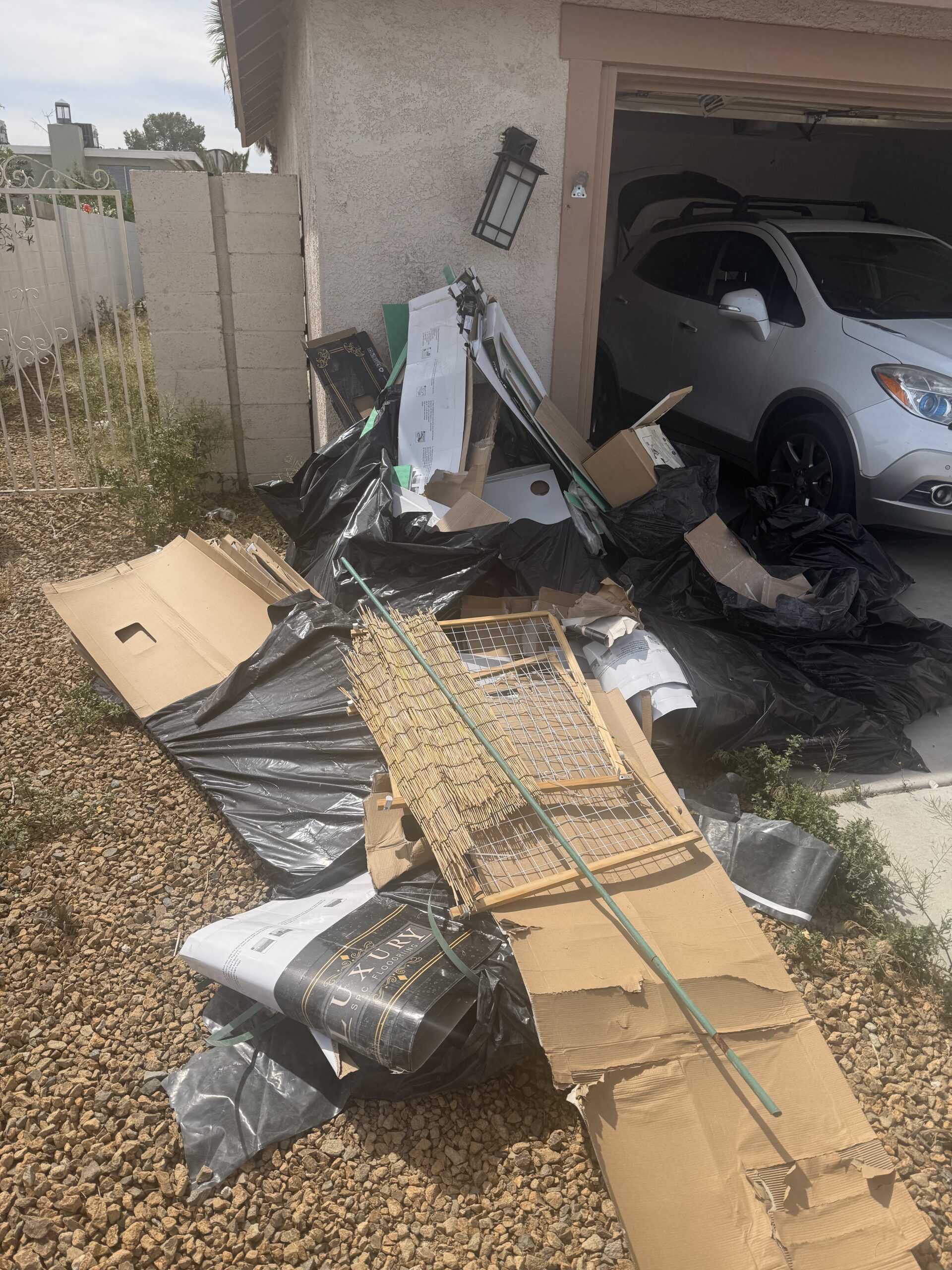 Before: Garage cleanout service moving boxes and old furniture in Summerlin NV